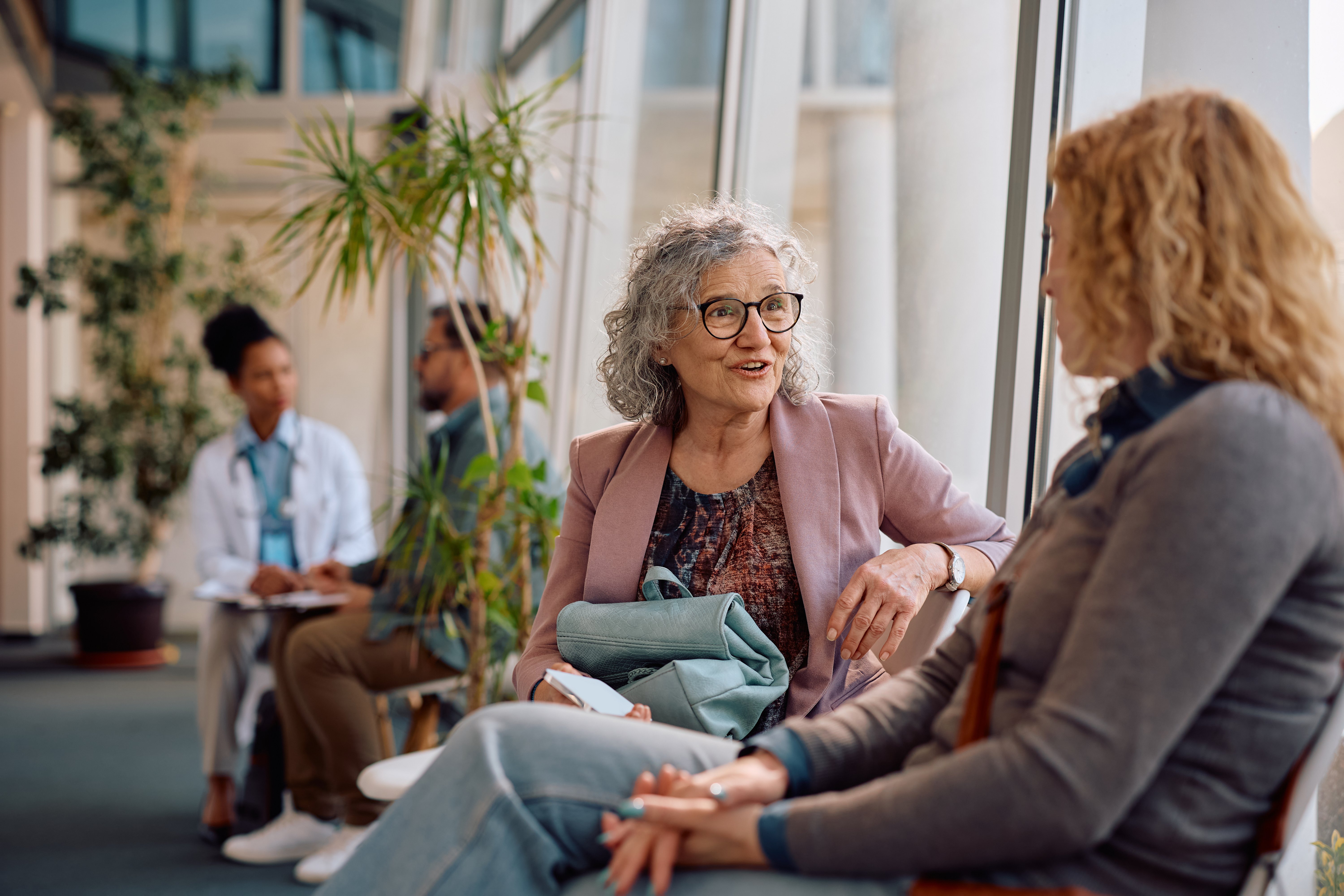 happy-senior-woman-talking-to-her-daughter-in-wait-2026-03-25-05-46-34-utc